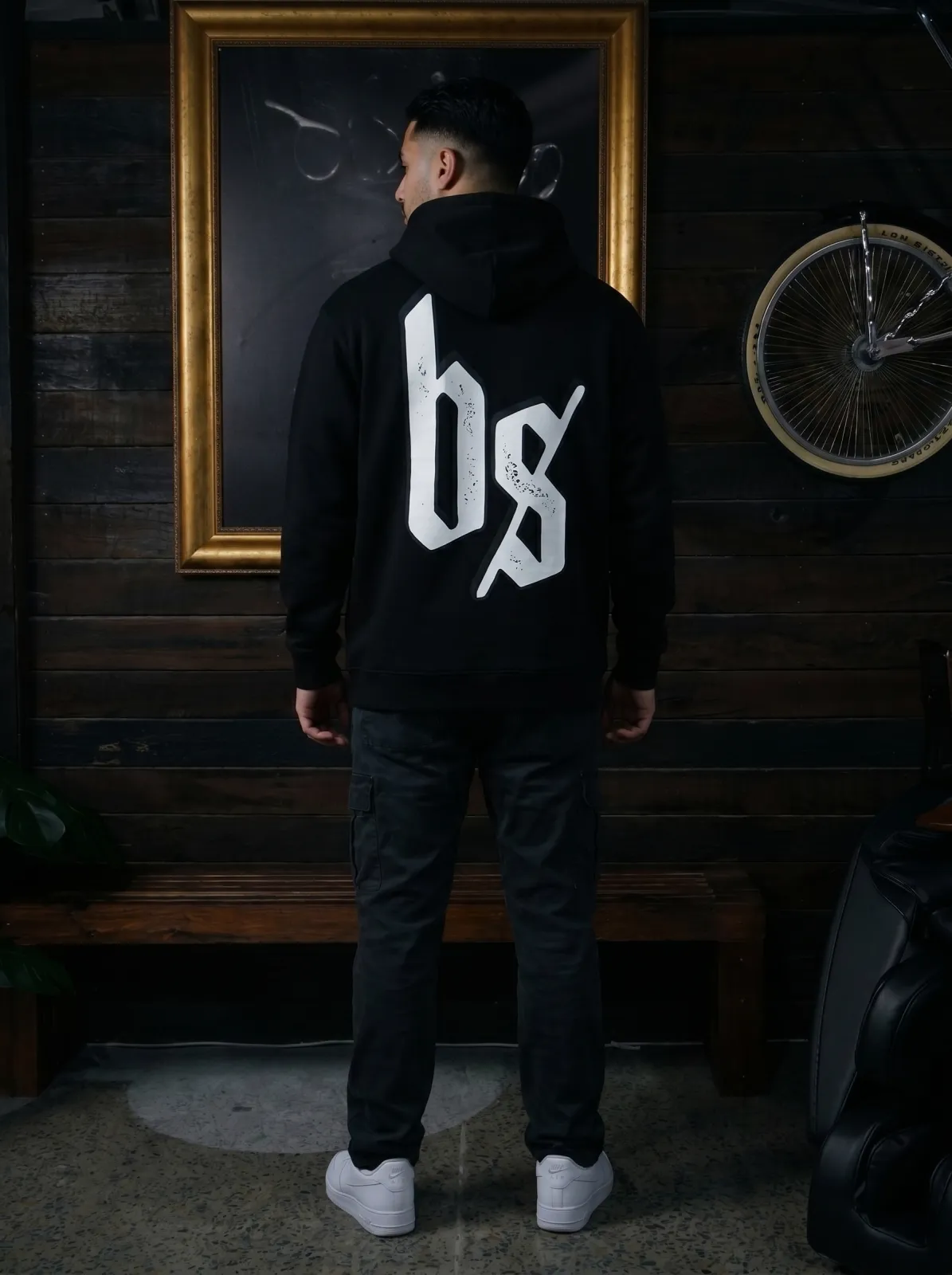 Blacksmith Heavy Hoodie — Black, worn back with bs print
