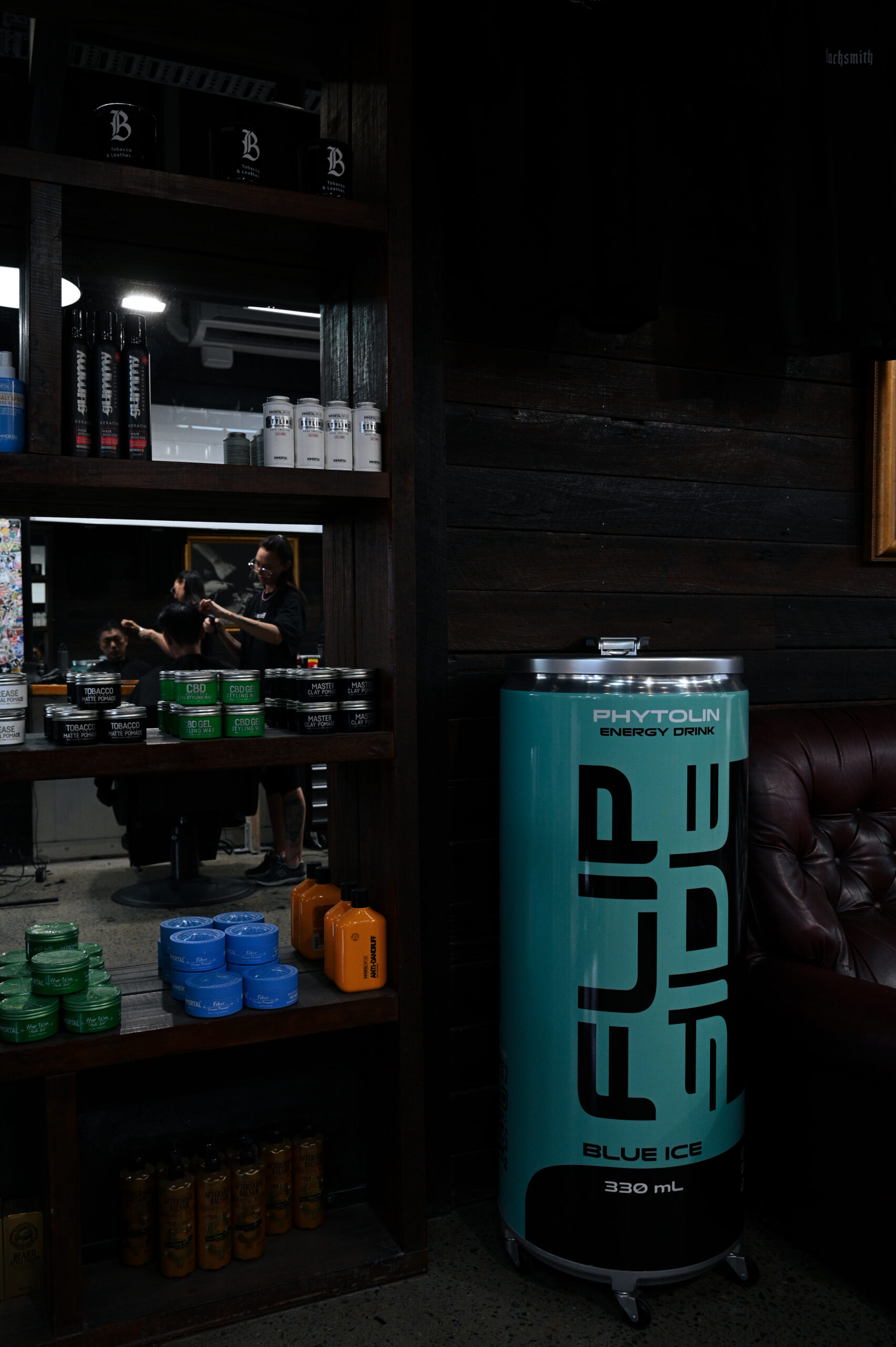 Product shelf and leather lounge inside Blacksmith
