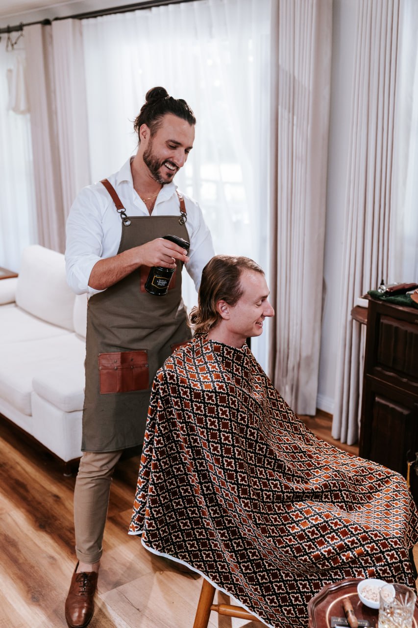 Ben grooming a client on location