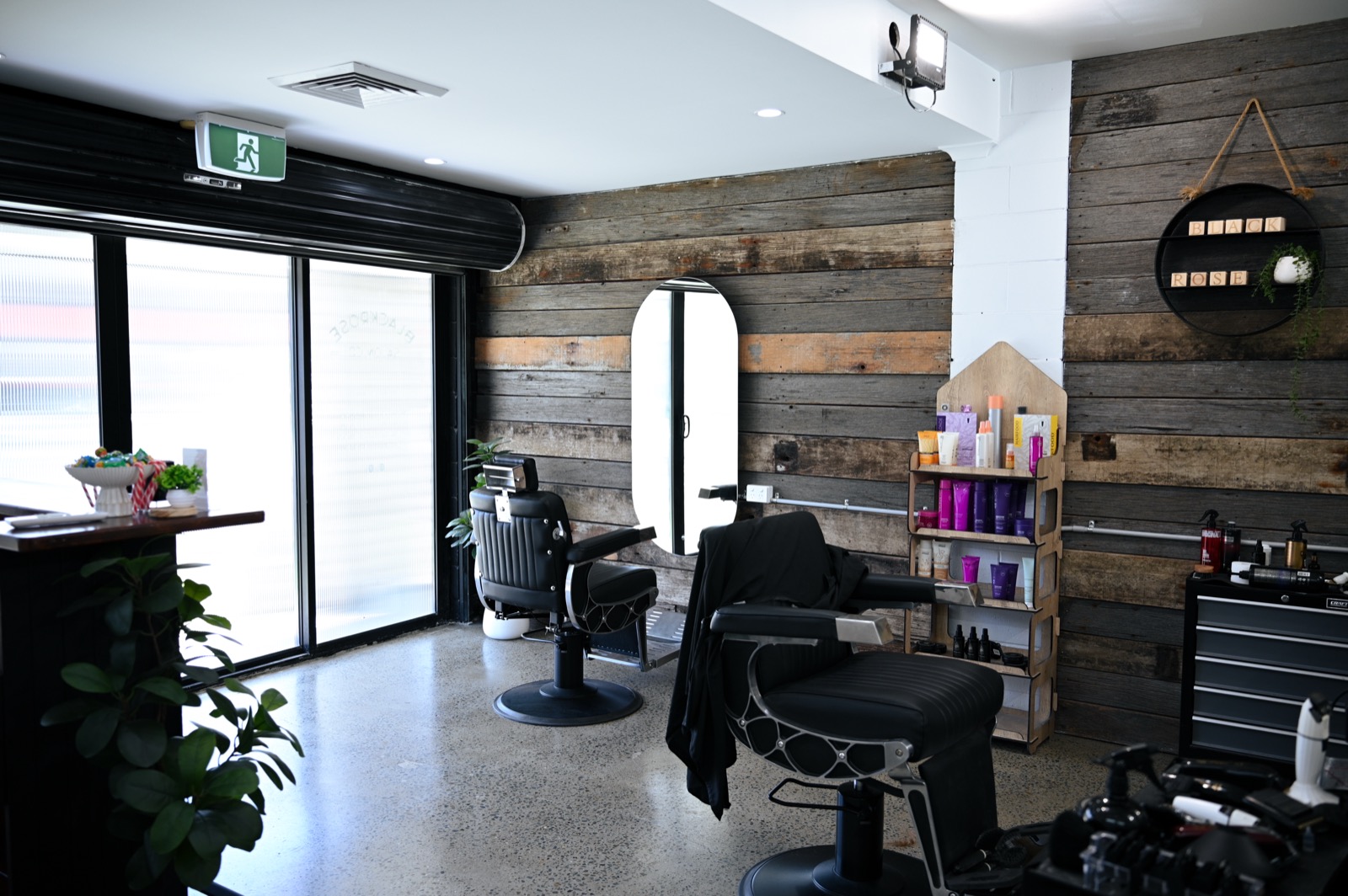 Inside the Blackrose Salon — soft lighting and refined timber